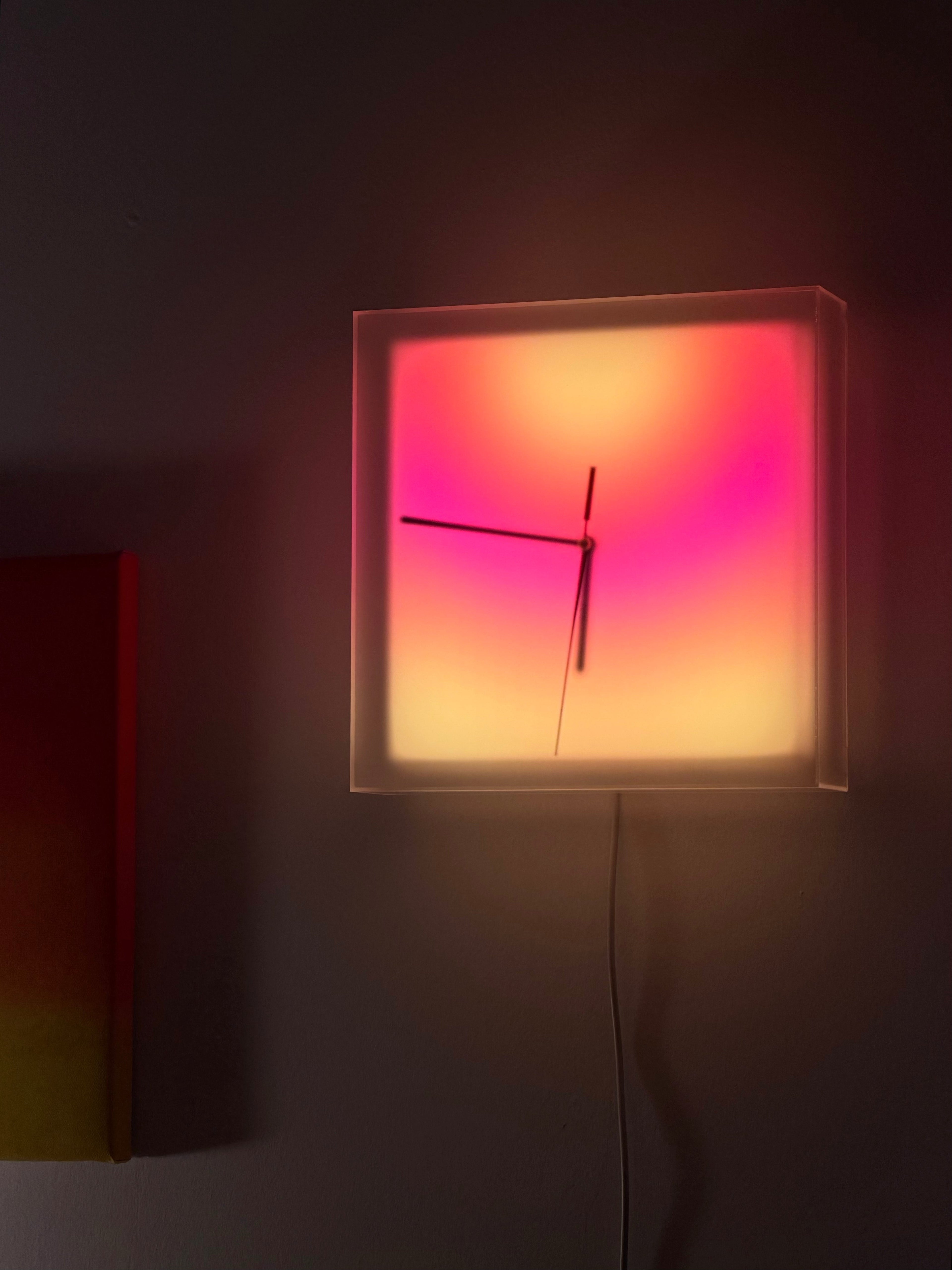 Solarglow Aurora Clock wall mounted warm sunset glow